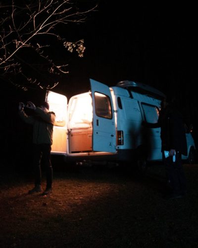 A van parked in the night with open doors on set of the short film IRIS
