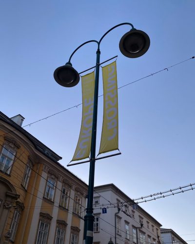 Flags on a lamppost advertising Crossing Europe in 2024