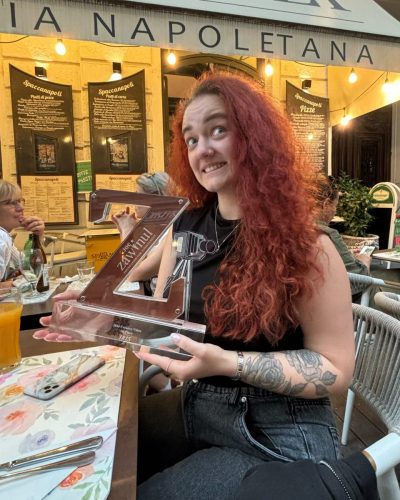 Simona Ascher holding the Zawinul Foundation For Achievement’s Creative Video Award